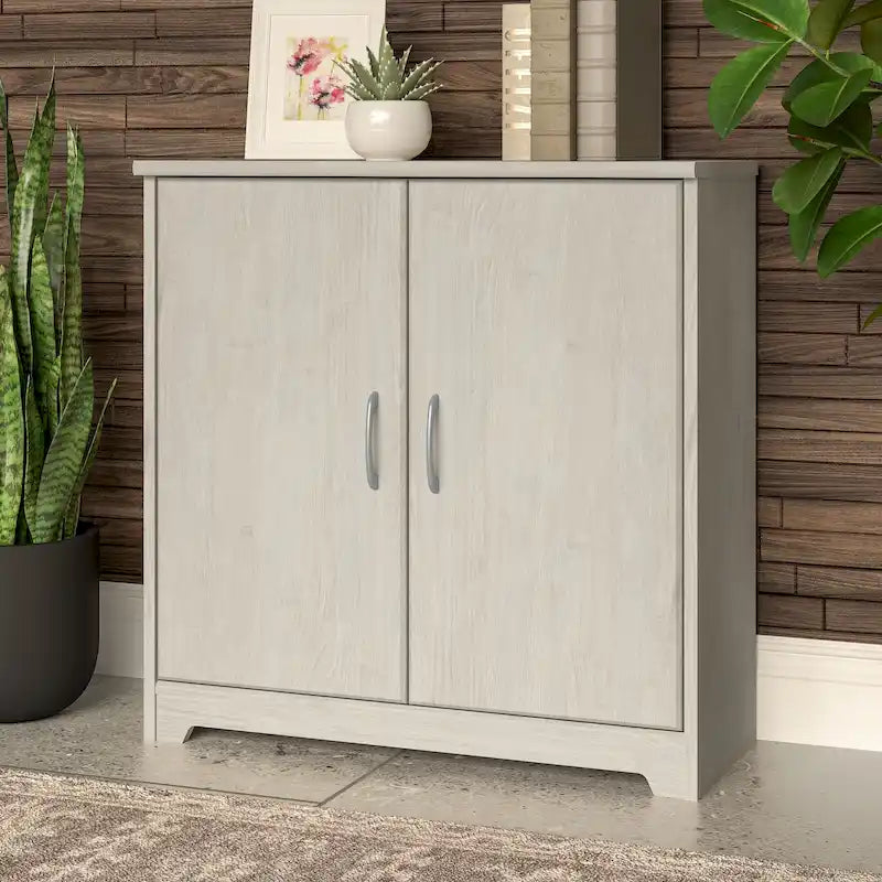 Petit meuble de rangement à 2 portes avec étagère réglable et poignées métalliques