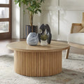 Table basse ronde cannelée à profil bas en bois massif, chêne ou noyer