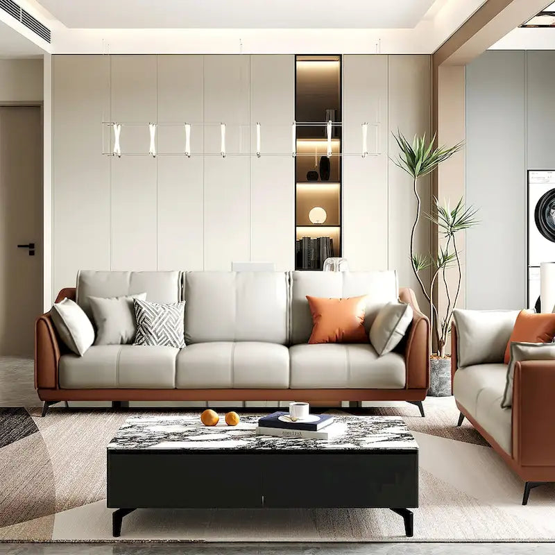 Canapé moderne trois places en similicuir avec pieds métalliques, accent orange